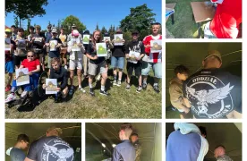 Grupa uczniów bierze udział w zajęciach strzeleckich oraz warsztatach prowadzonych przez żołnierzy podczas wydarzenia edukacyjnego.