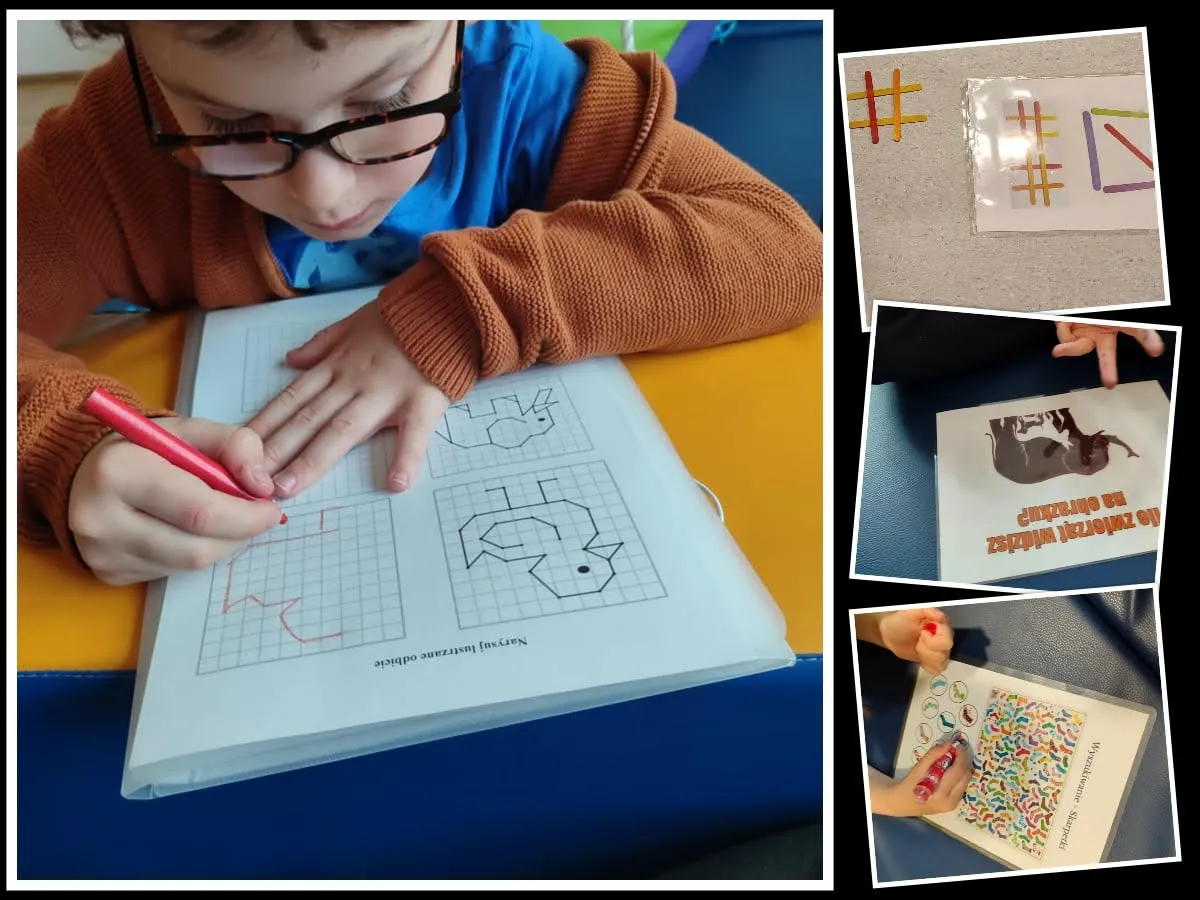 Chłopiec w okularach rysuje czerwonym flamastrem po śladzie w zeszycie z ćwiczeniami grafomotorycznymi.